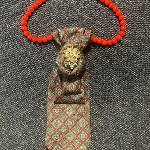 Elegant Patterned Tie with Red Beaded Necklace